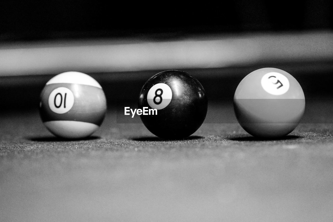 Close-up of pool ball on table