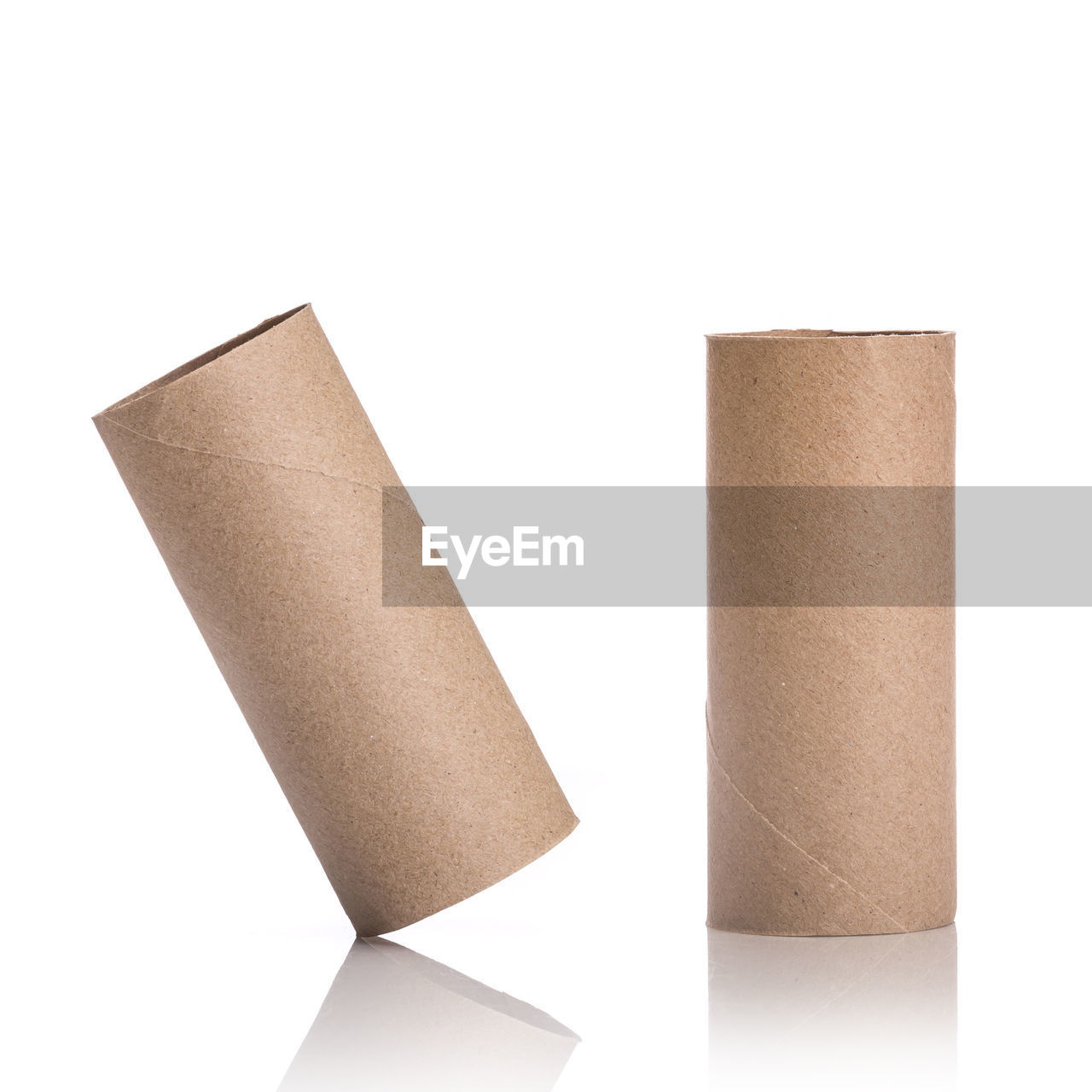 Close-up of brown paper rolls on white background