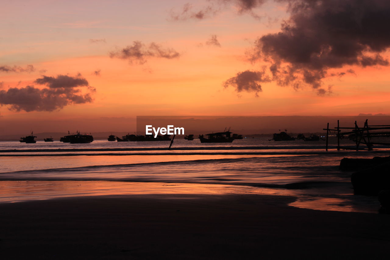 SCENIC VIEW OF SUNSET OVER SEA