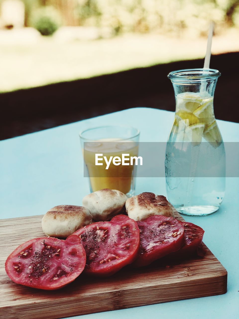 CLOSE-UP OF DRINK WITH JUICE ON TABLE