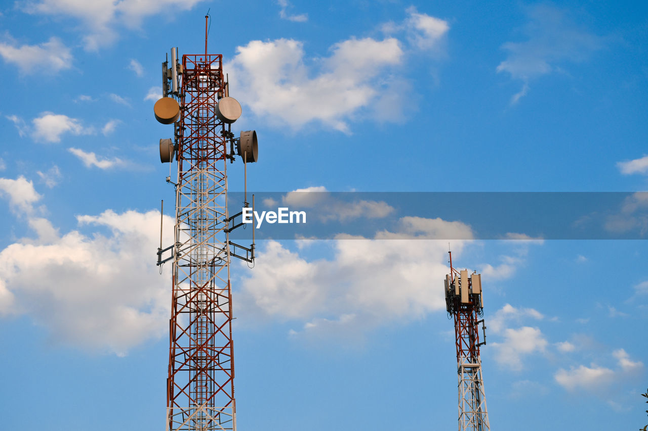 Low angle view of electricity pylon against sky