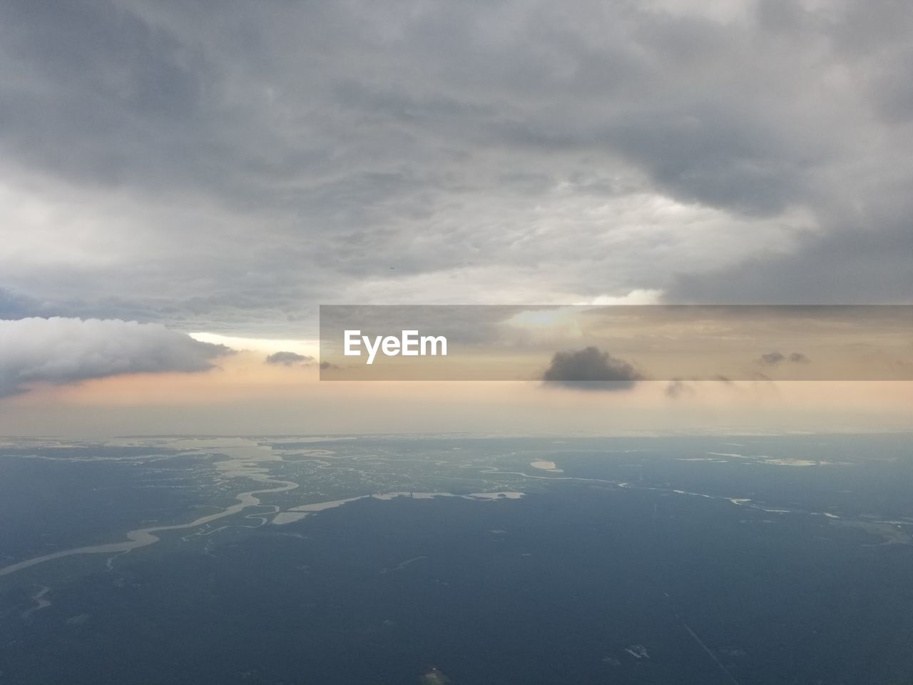 SCENIC VIEW OF CLOUDS OVER SEA AGAINST SKY