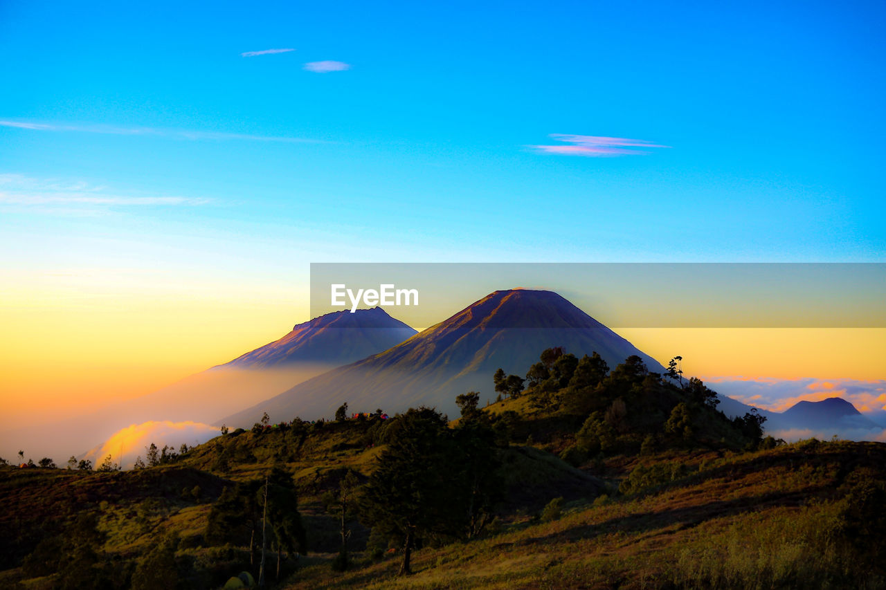 scenic view of snowcapped mountains against clear sky during sunset