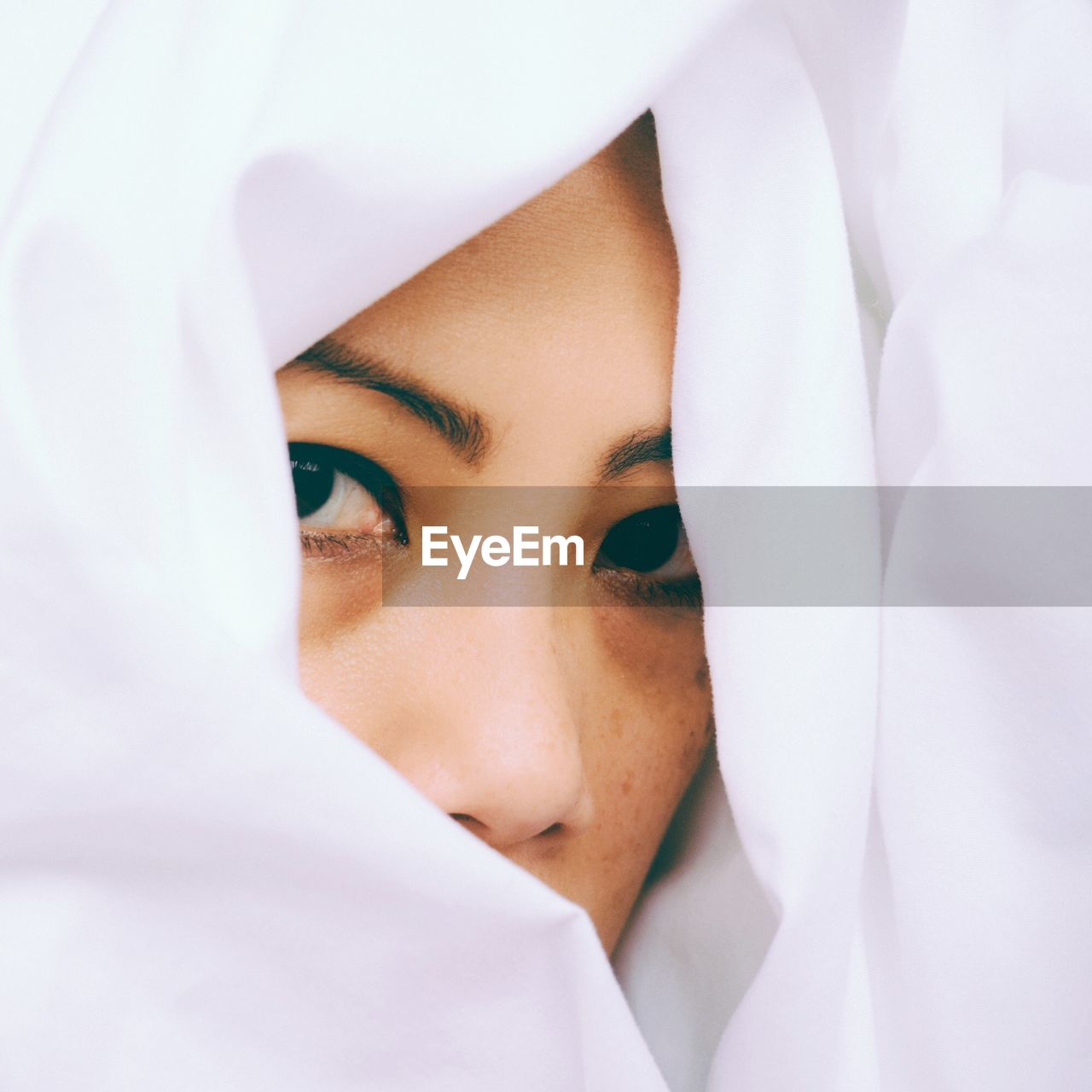 Close-up of woman covered in fabric