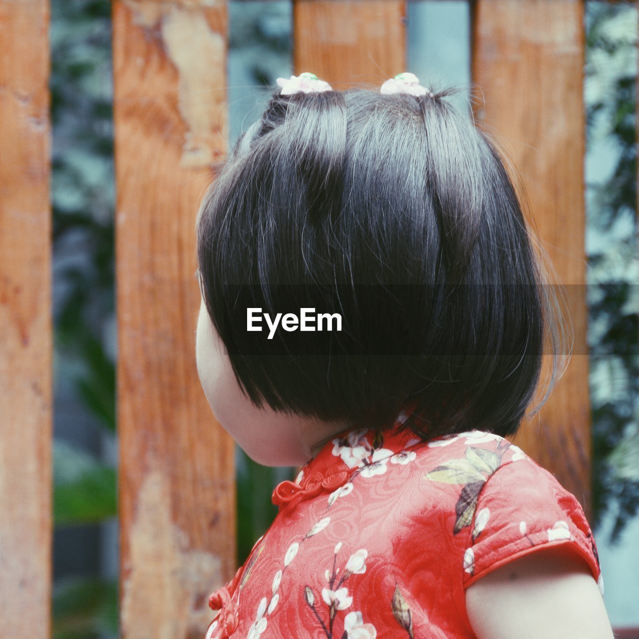 Low angle view of girl with black hair