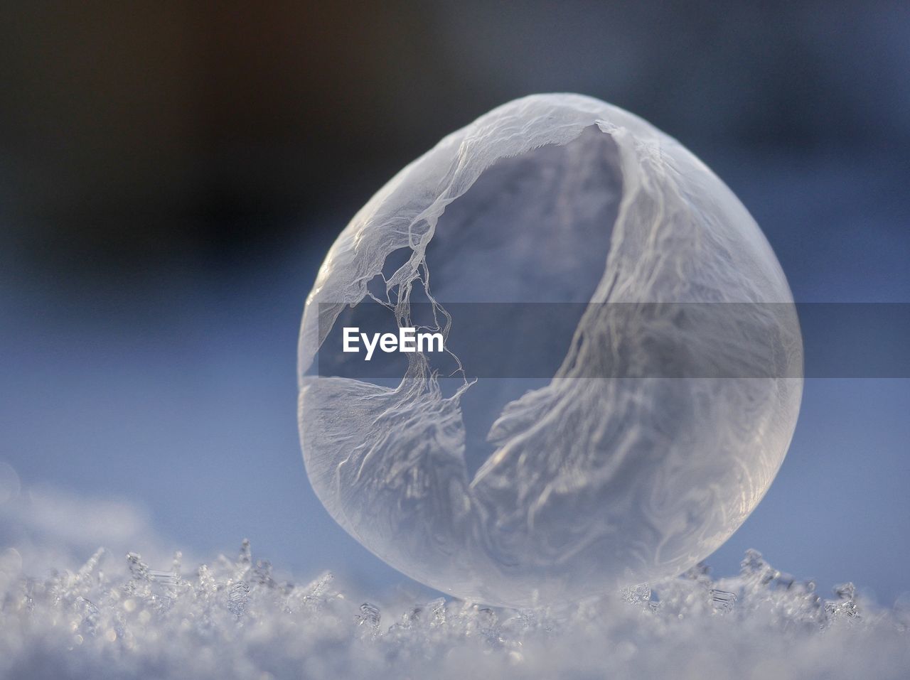 Macro shot of soap bubble on ice