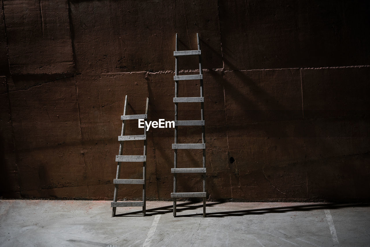 Wooden ladders outdoors during night