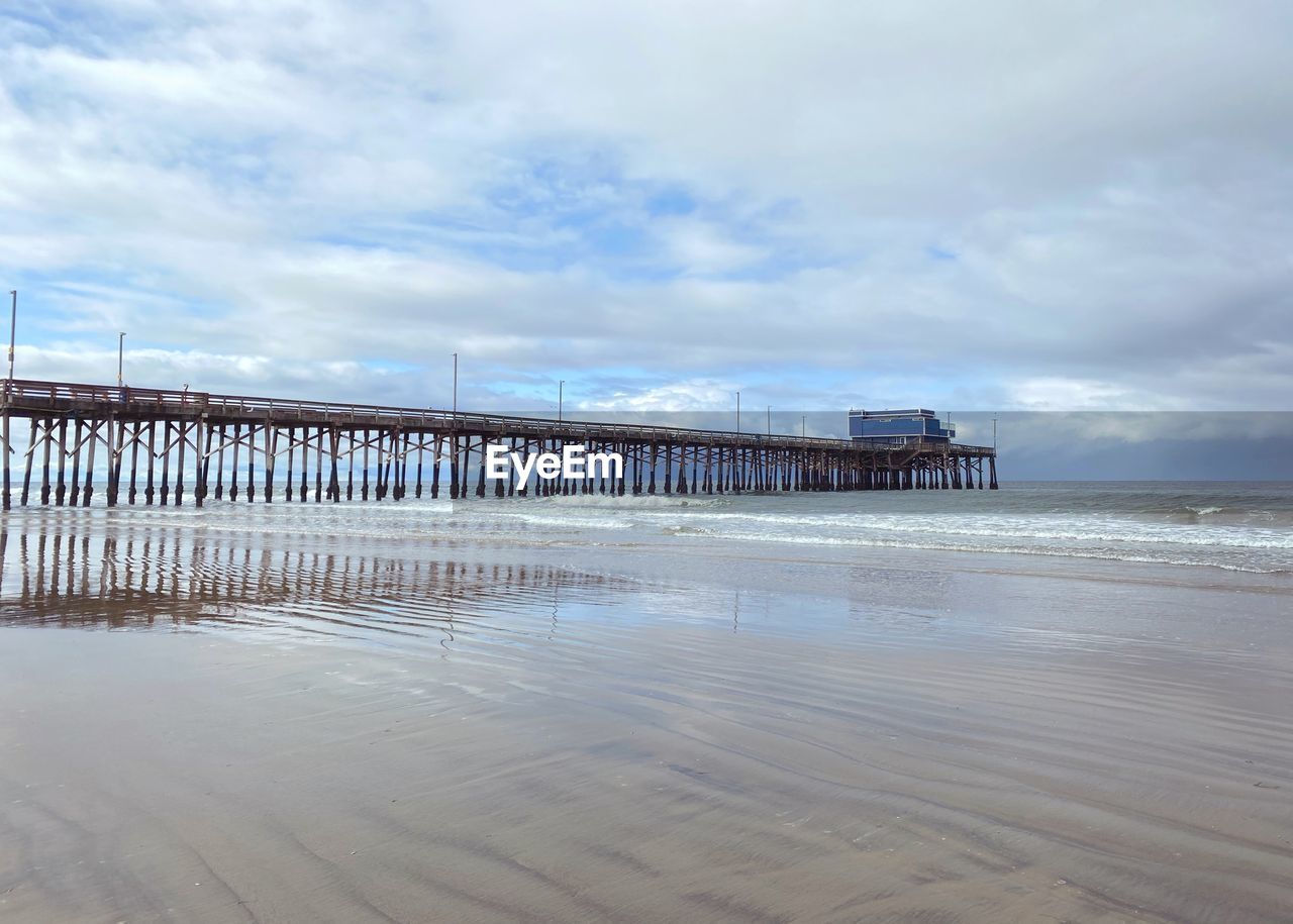 Pier over sea against sky