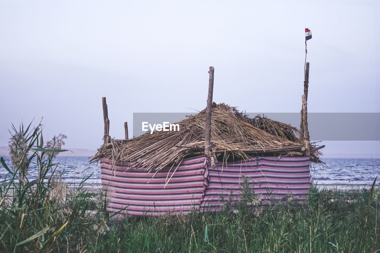 Built structure on field against clear sky