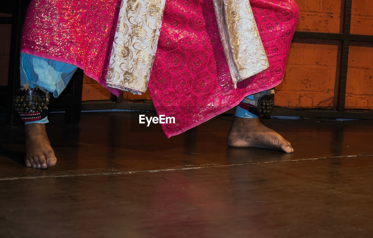 Low section of woman standing on floor