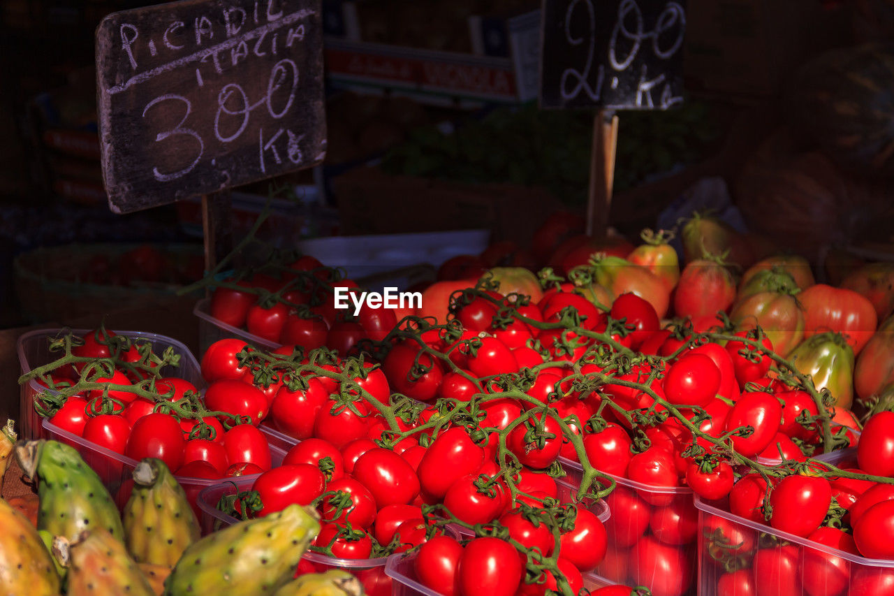 high angle view of tomatoes for sale at market stall