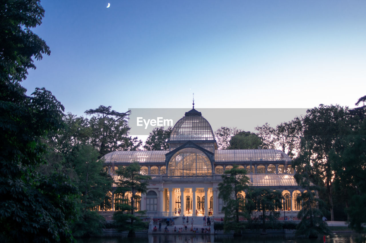 Illuminated government building against sky during sunset