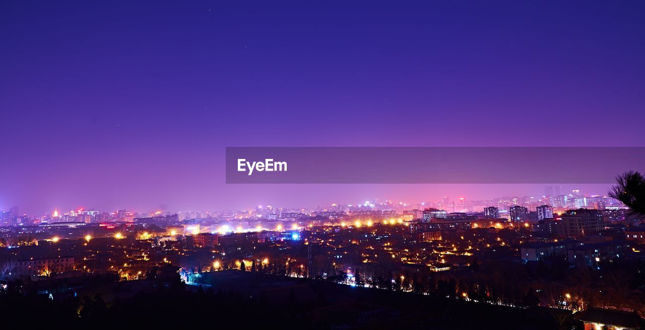 Illuminated cityscape at night