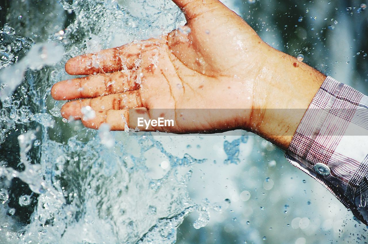 Cropped image of man in water