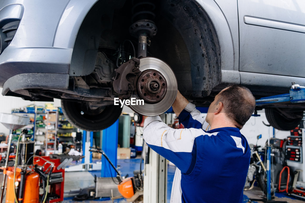 Man repairing car tire