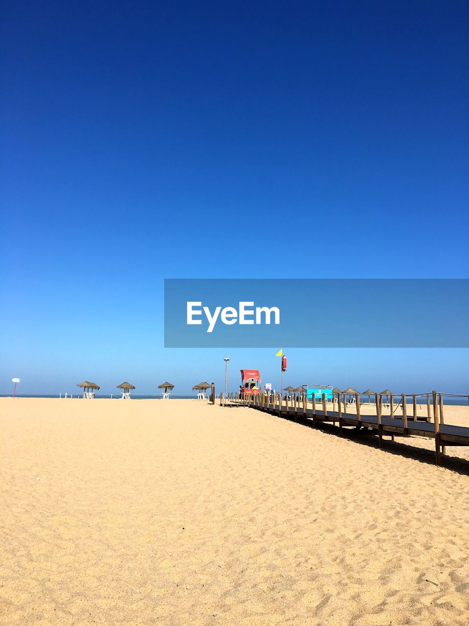 SCENIC VIEW OF BEACH AGAINST CLEAR SKY