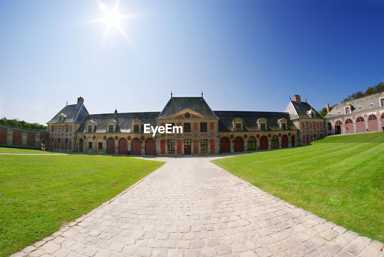 Chateau de vaux-le-vicomte against blue sky on sunny day