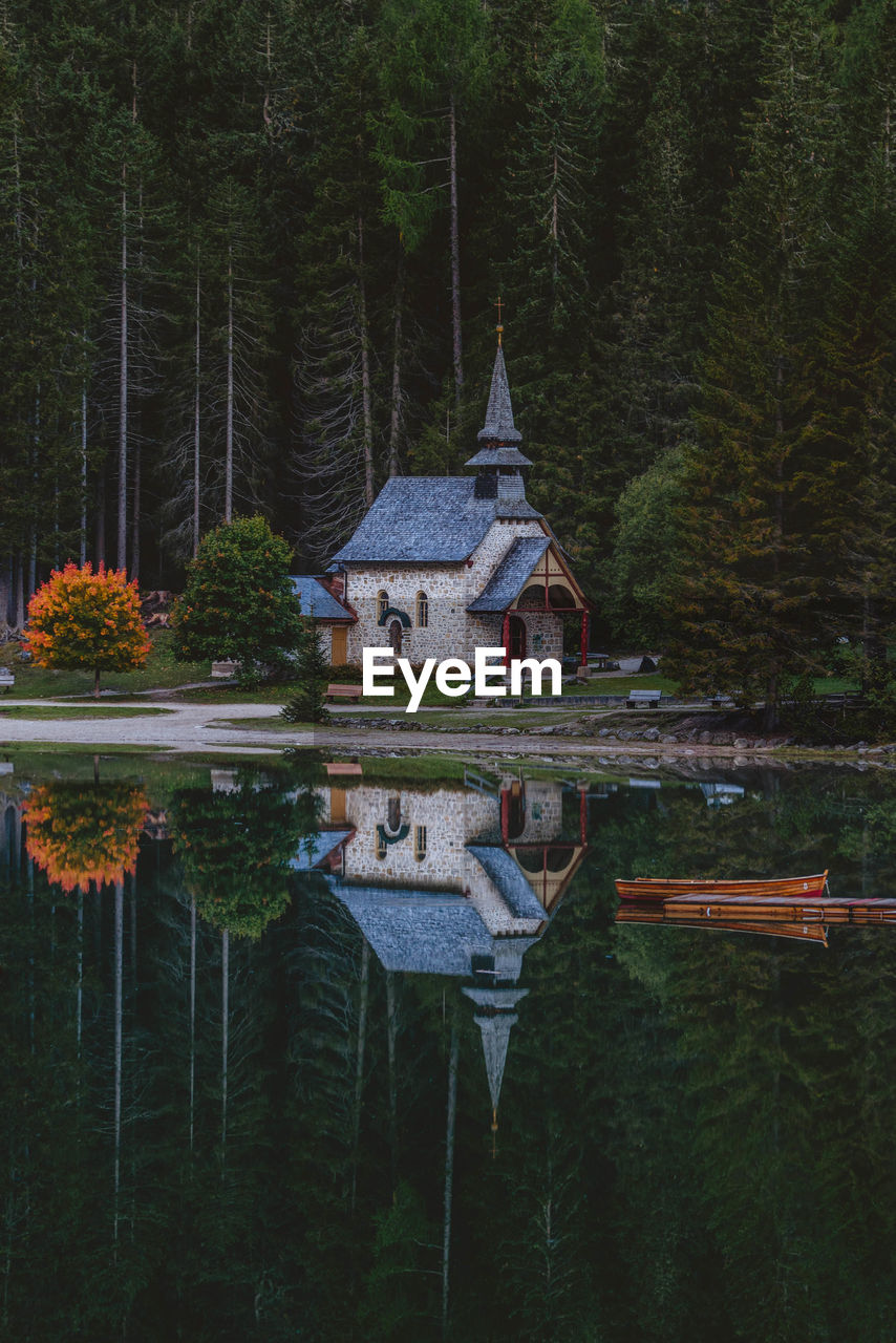 TEMPLE BY LAKE IN FOREST