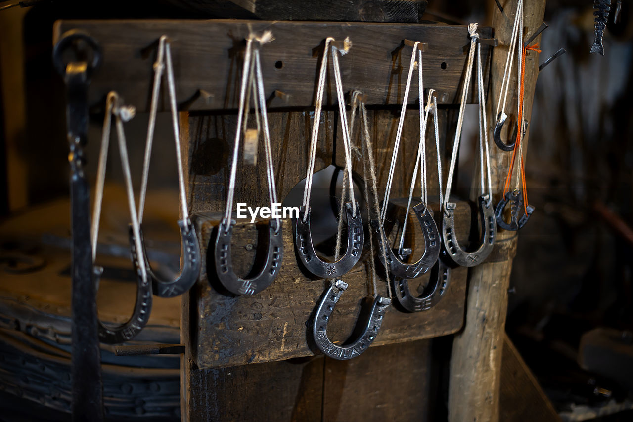 Blacksmith decorative horseshoes elements hanging at forge. handmade and craftsmanship 