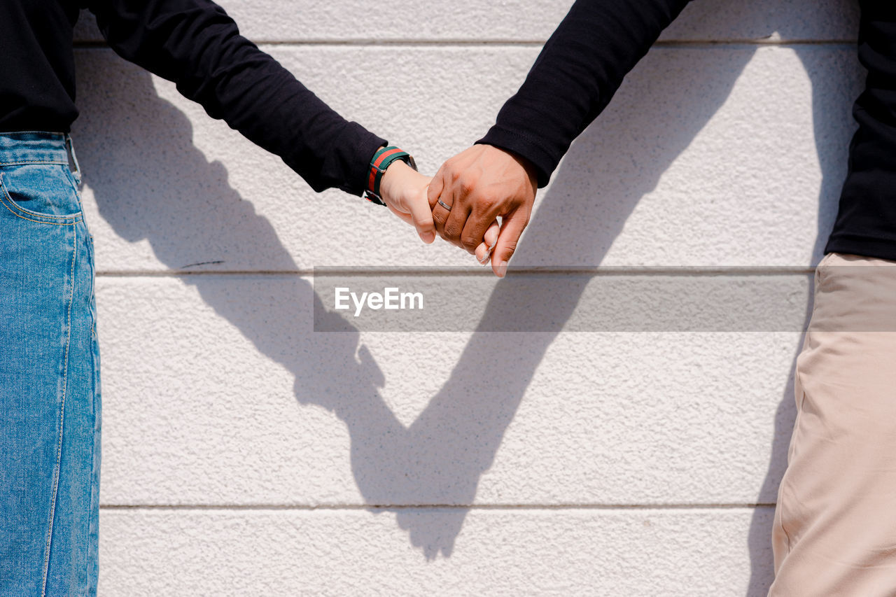 High angle view of couple holding hands