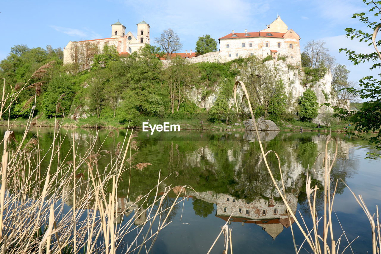 PANORAMIC VIEW OF LAKE AND BUILDINGS