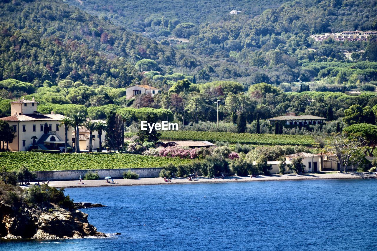Old vineyard building by sea against mountain