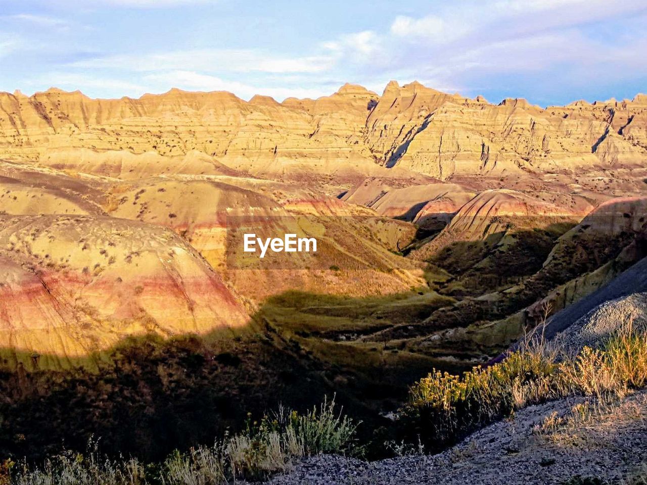 Scenic view of rocky mountains against sky