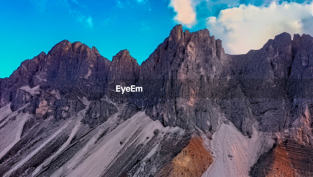 Panoramic view of rocky mountains against sky