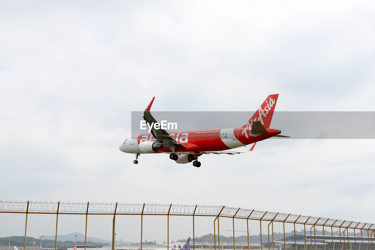 LOW ANGLE VIEW OF AIRPLANE IN SKY