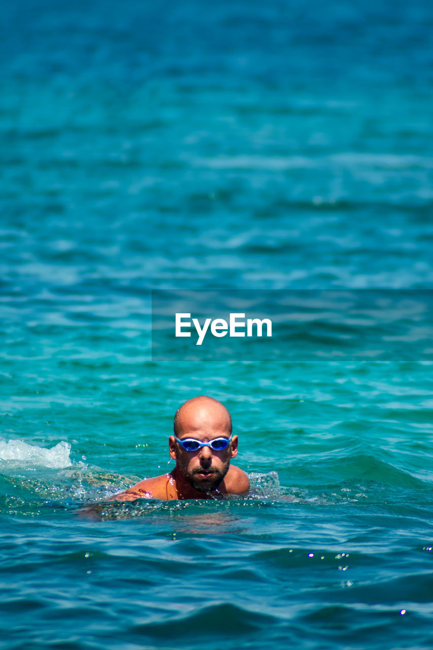 Portrait of man swimming in sea