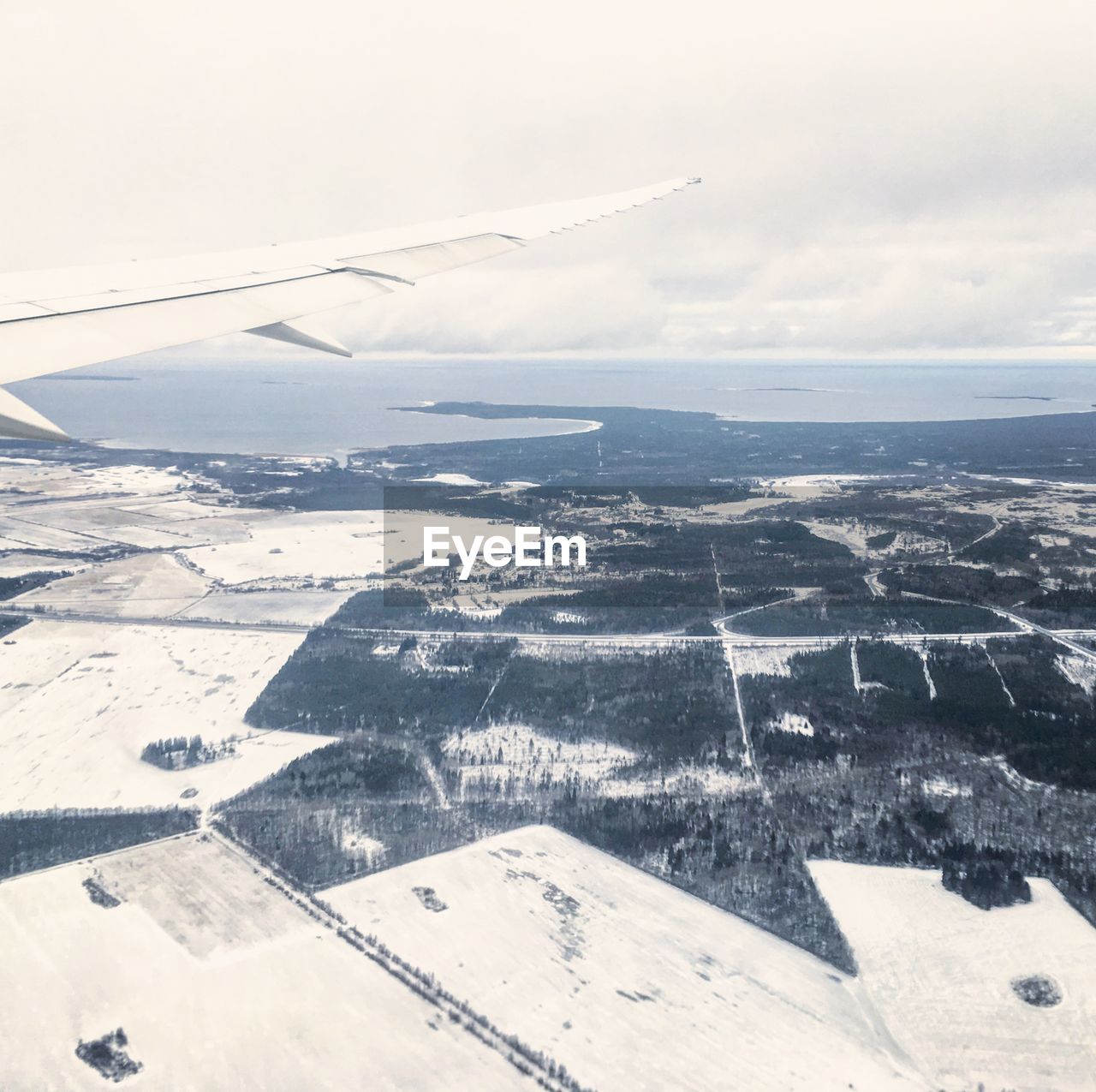 AERIAL VIEW OF LANDSCAPE AGAINST SKY DURING WINTER