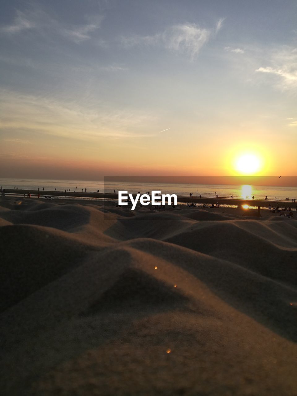 SCENIC VIEW OF BEACH DURING SUNSET