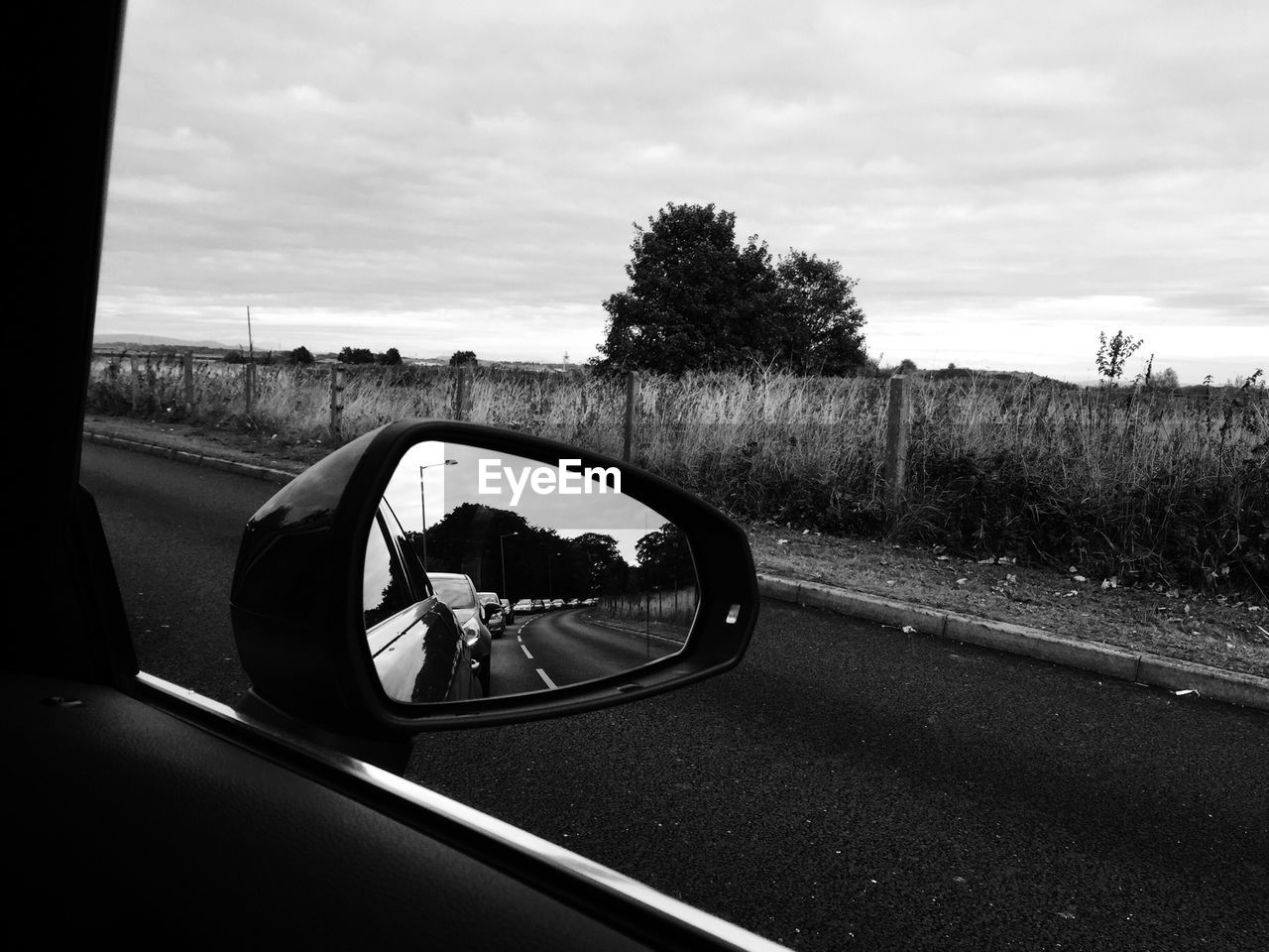 Reflection in side-view mirror