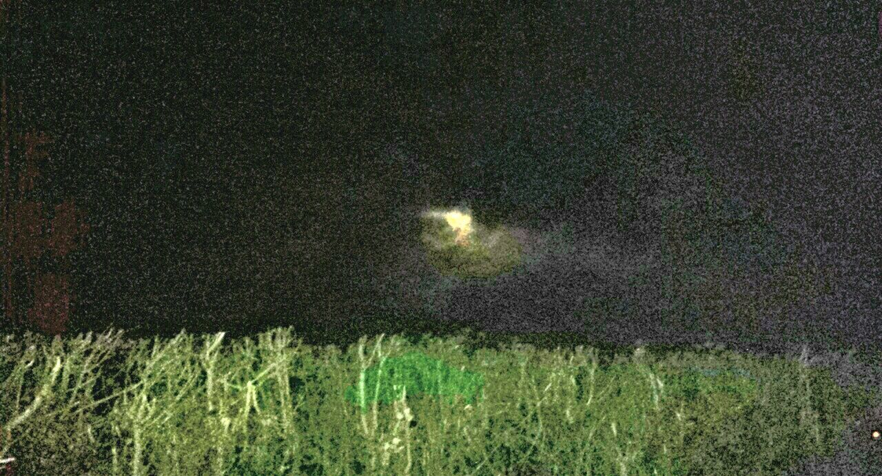 SCENIC VIEW OF GRASSY FIELD AGAINST SKY AT NIGHT