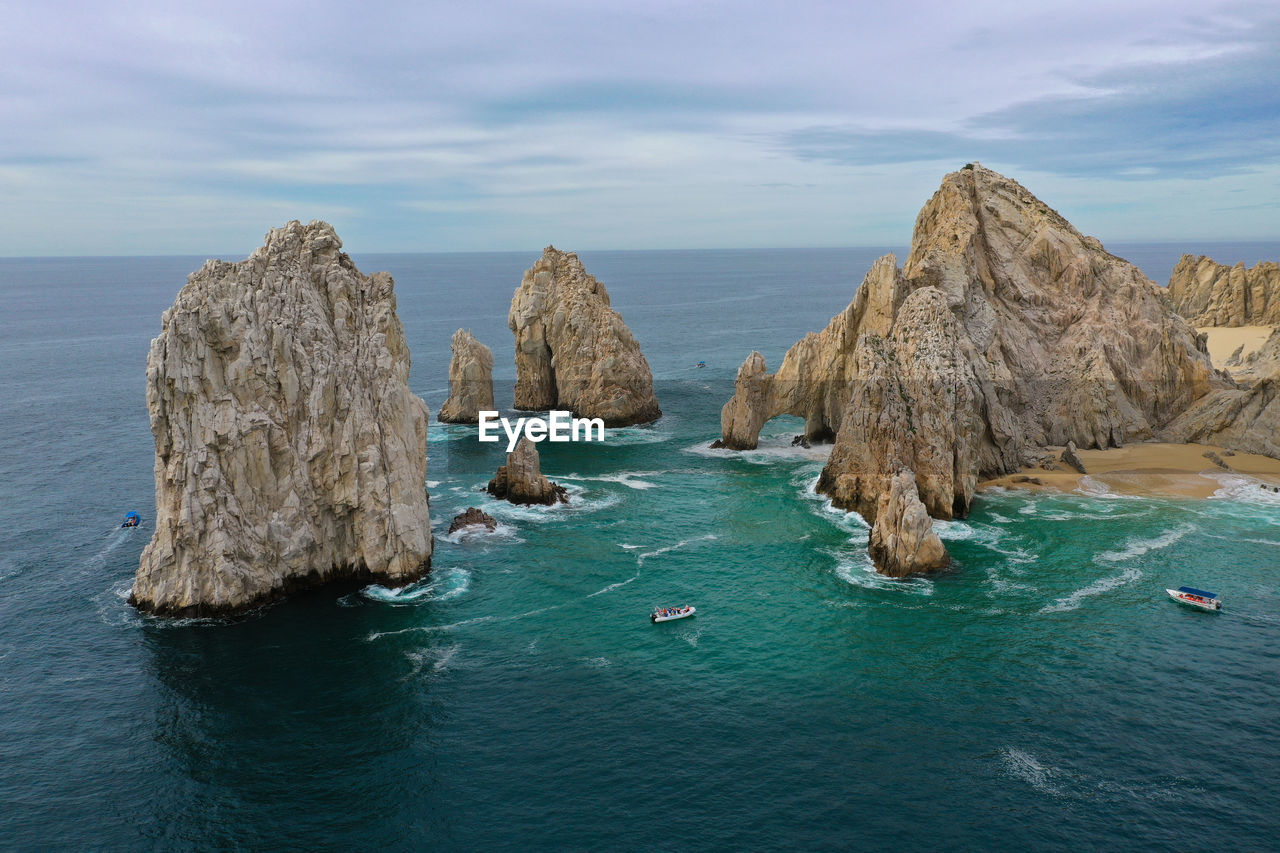 Panoramic view of rocks in sea against sky