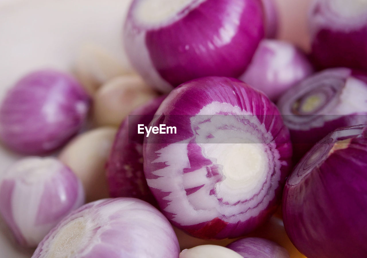 food and drink, food, freshness, vegetable, healthy eating, wellbeing, purple, pink, no people, onion, produce, close-up, petal, raw food, still life, red onion, indoors, flower, large group of objects, organic, spanish onion, ingredient, studio shot, abundance, shallot, backgrounds, selective focus