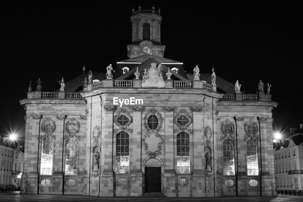 LOW ANGLE VIEW OF ILLUMINATED BUILDING