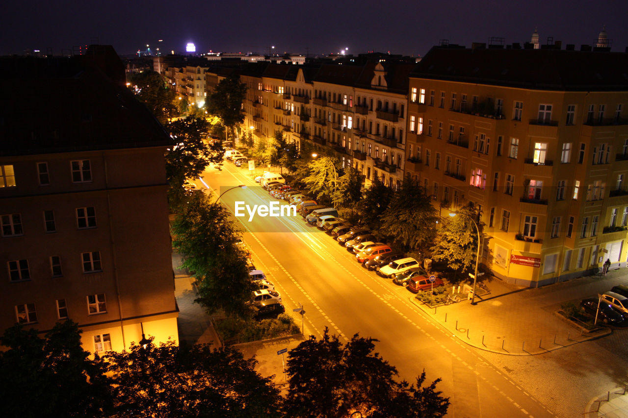 LIGHT TRAILS ON CITY STREET AT NIGHT