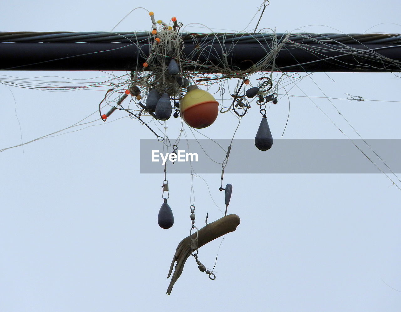 Low angle view of fishing equipment against clear sky