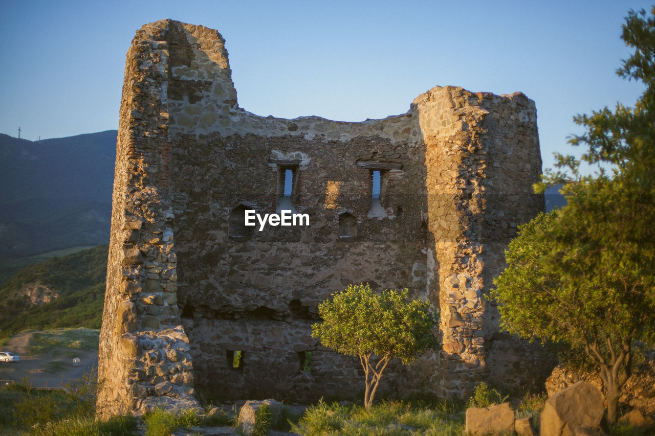 OLD RUIN BUILDING AGAINST CLEAR SKY