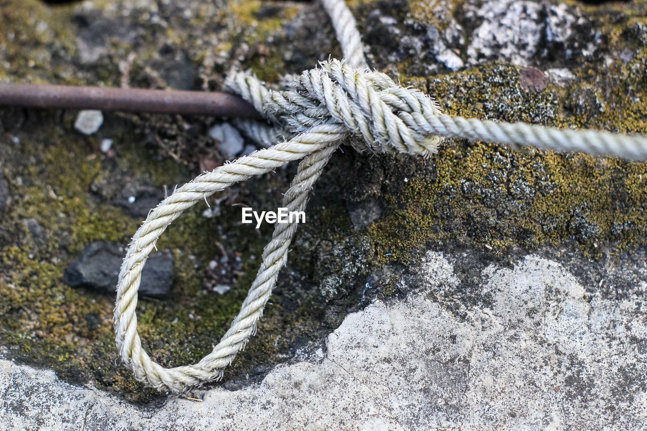 Close-up of rope tied on metal