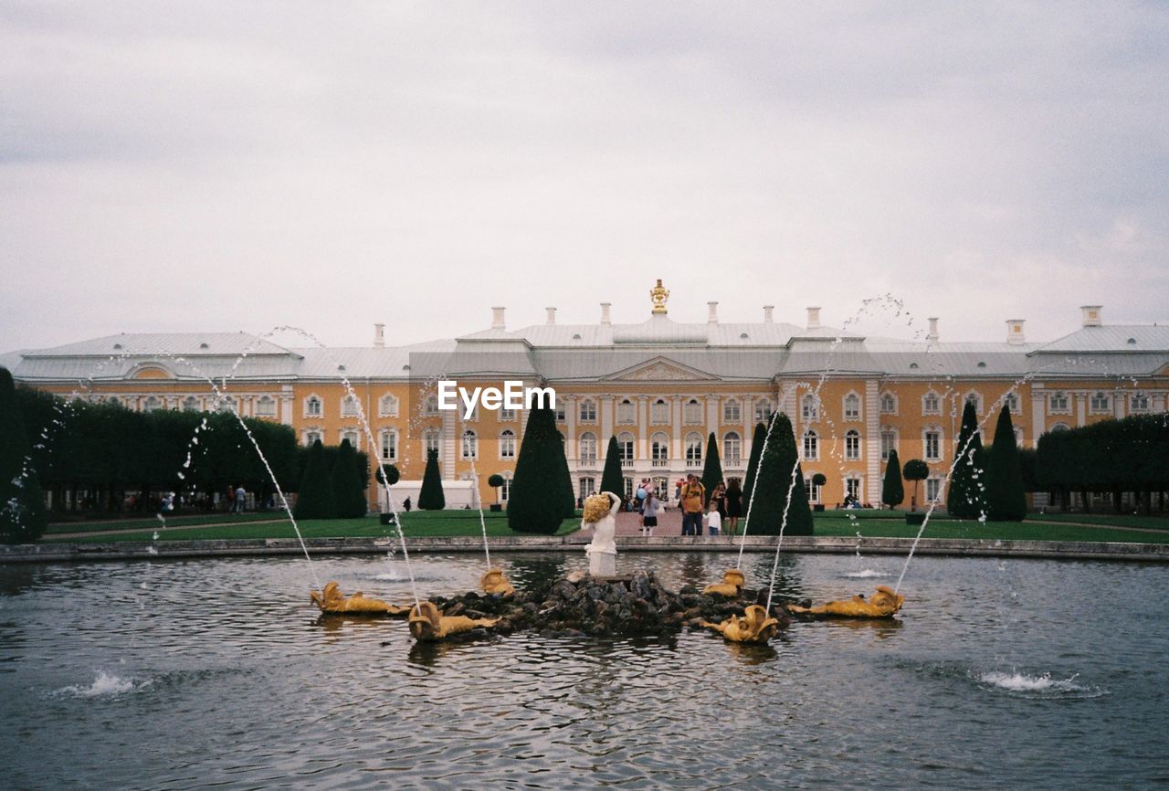 PEOPLE IN BOAT ON WATER