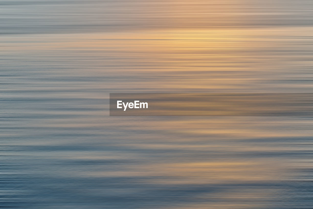 Scenic view of sea against sky at sunset