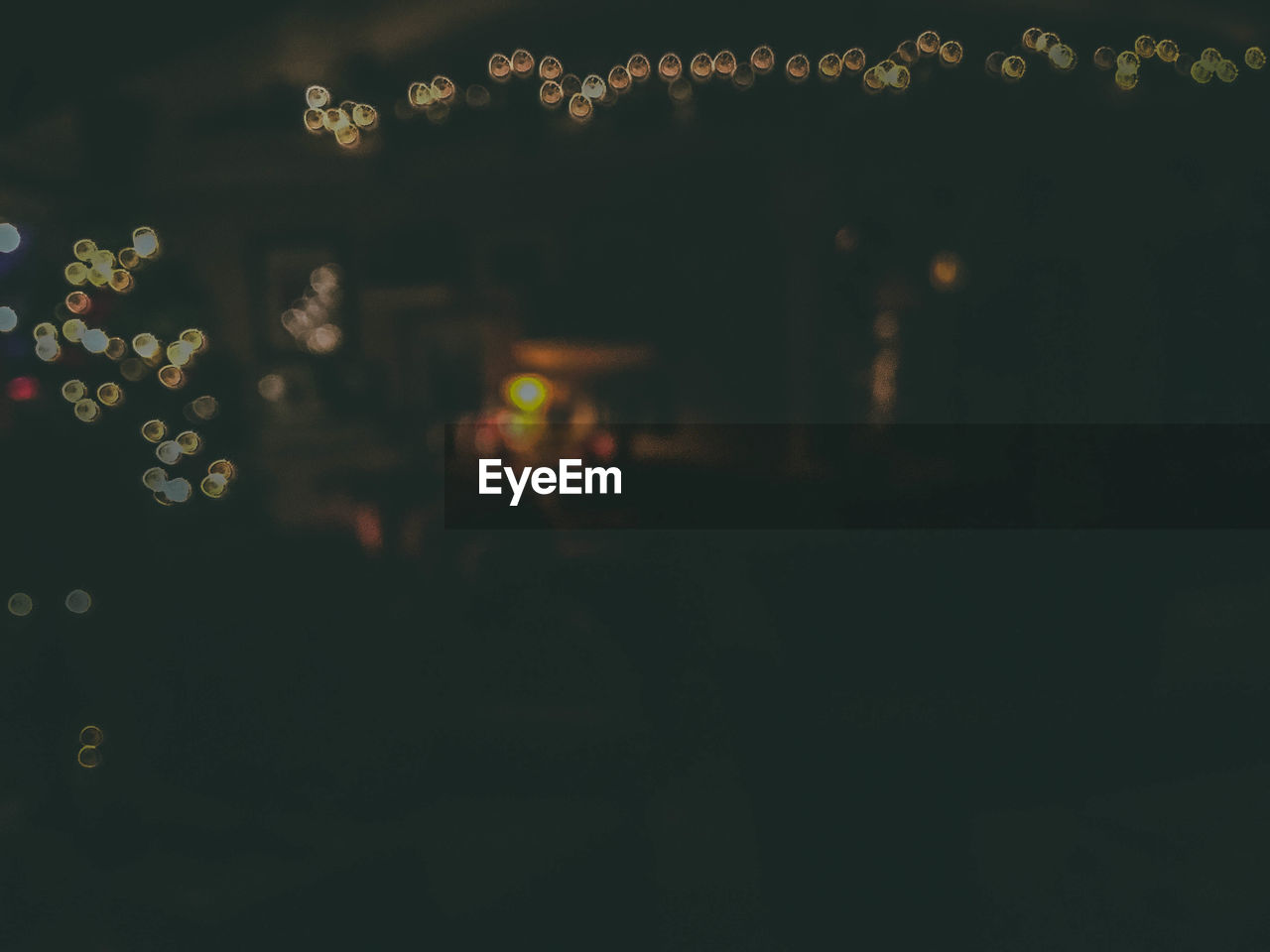 Defocused image of illuminated lights at night
