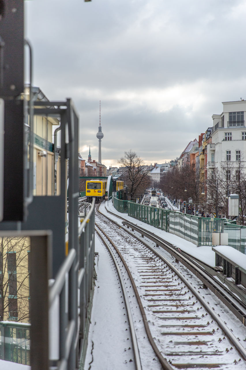 Train at railroad station against sky