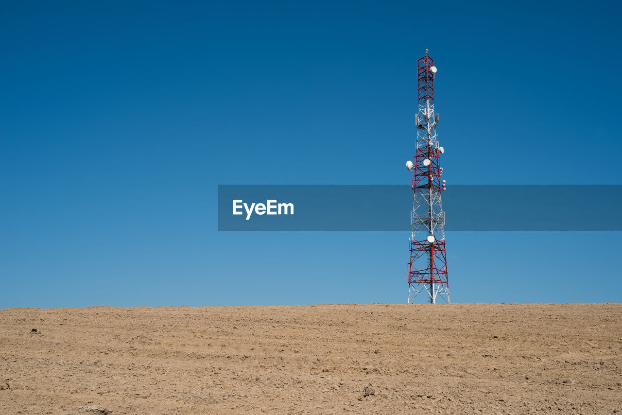 Communication tower with clear blue sky