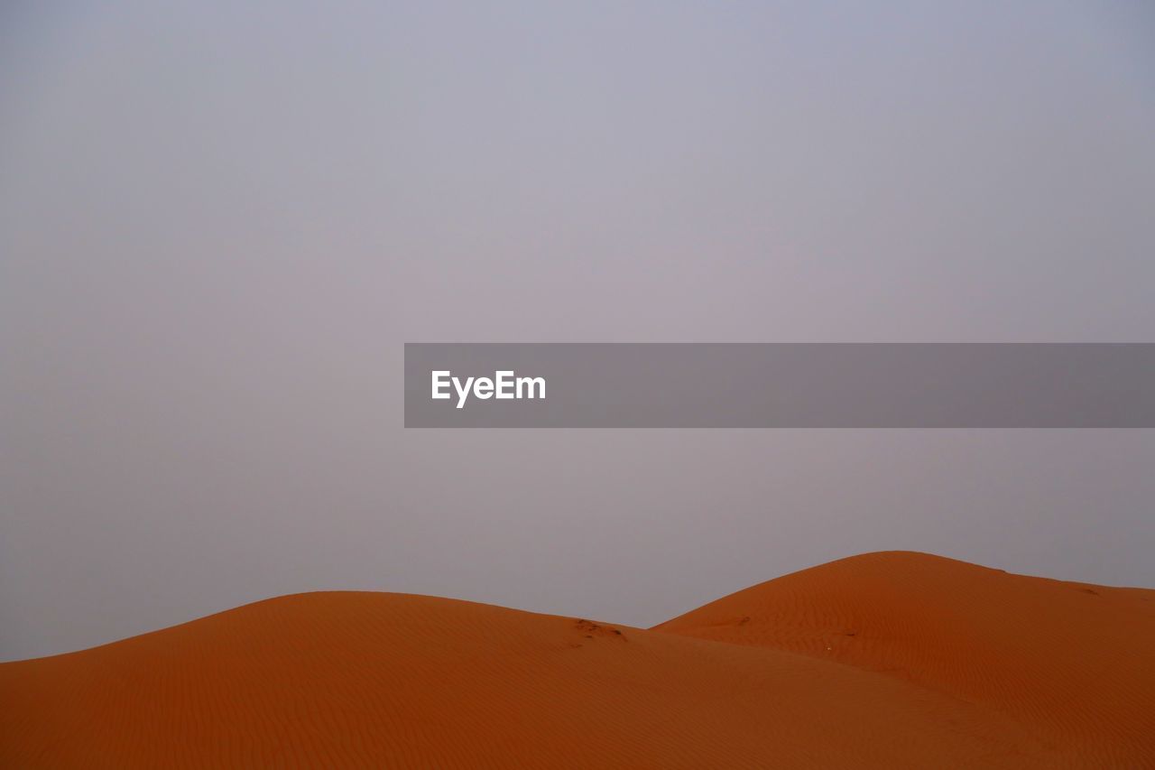 Scenic view of desert against clear sky