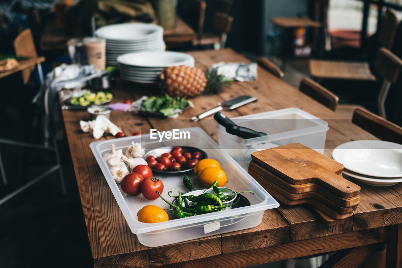 High angle view of fruits and vegetables in container on table