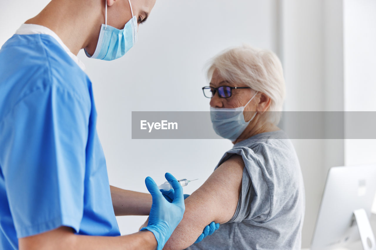 Doctor examining patient at clinic