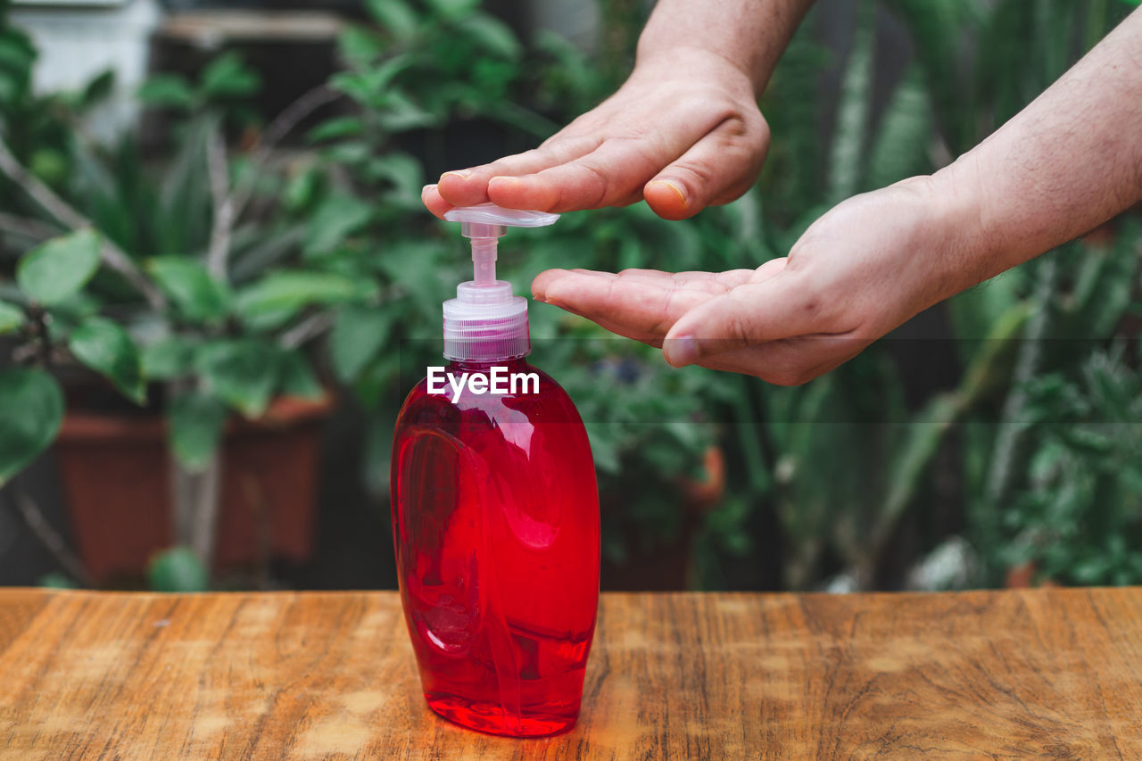 Close-up of hand using antibacterial liquide soap 